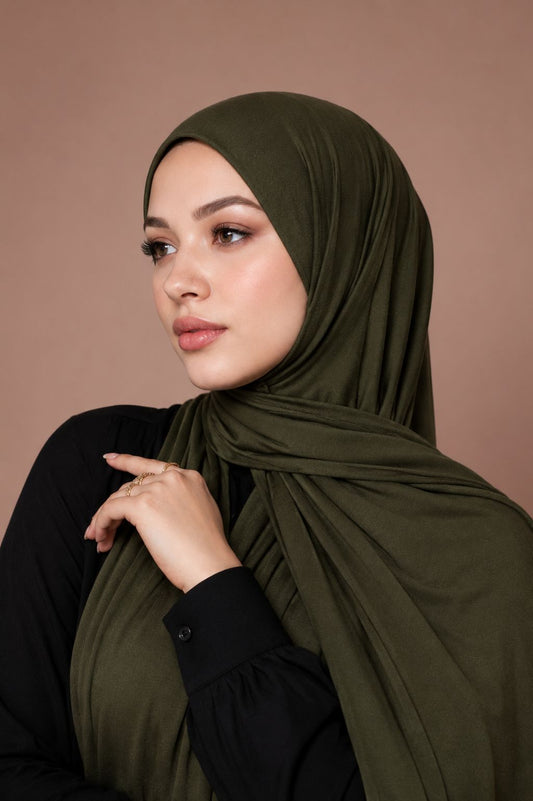 Shop the  Premium Jersey Hijab - Olive Green by Mawdeest. Premium party wear hijab featuring luxurious satin silk texture, elegant shine, and graceful drape. Perfect for weddings, Eid, festive occasions, and special celebrations. Buy hijab online in India.
